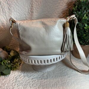 Elegant Cream Leather Crossbody with Decorative Tassel